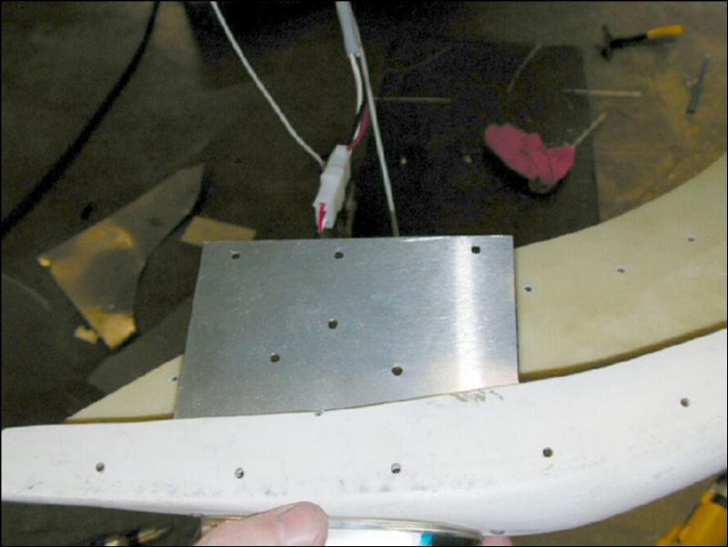 Drill wing tip grounding plate for A4 rivets